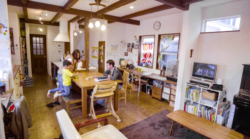 japanese family and homestay student at table in living room