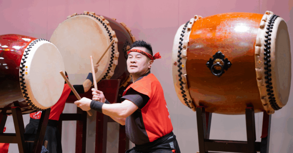man drumming on taiko drum