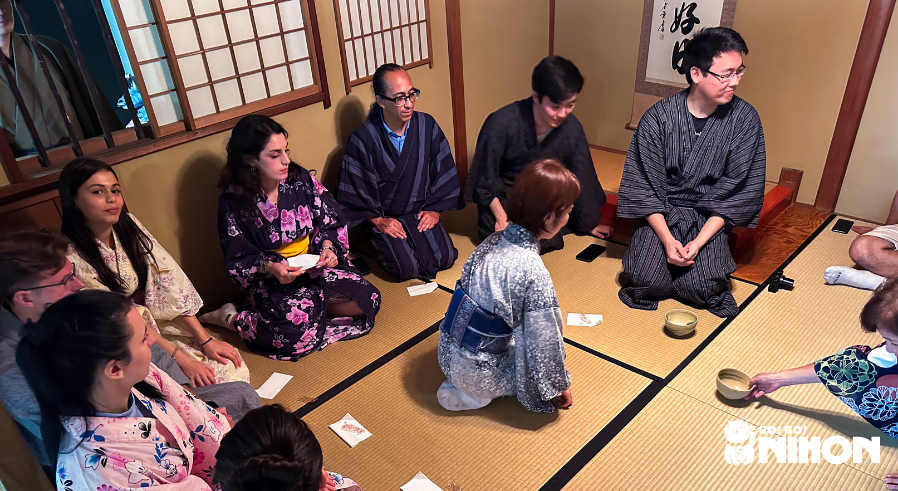 A group of Study Trippers attending a traditional tea ceremony dressed in yukata.