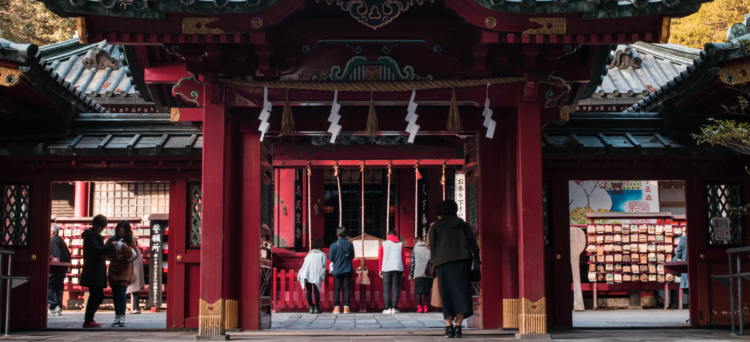 New year in Japan, image of people praying at a temple