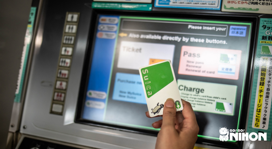 Hand holding one of the Suica IC cards in Japan.