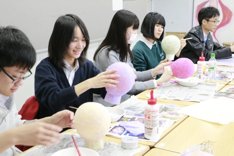 A photo of Yokohama Design College students enjoying a design class.