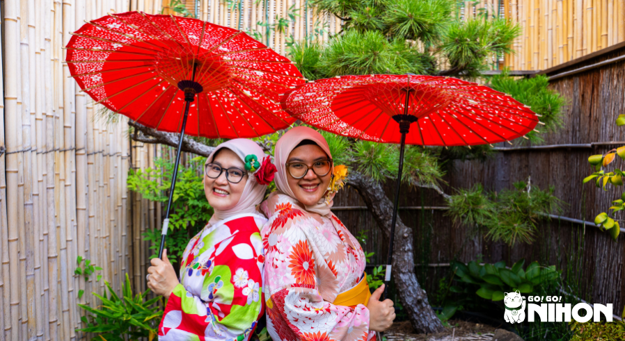 two women posing in kimono on a study trip