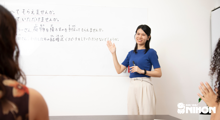 Japanese teacher teaching students japanese