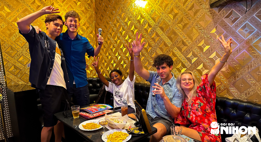 a group of study trippers making friends while studying abroad in japan at karaoke