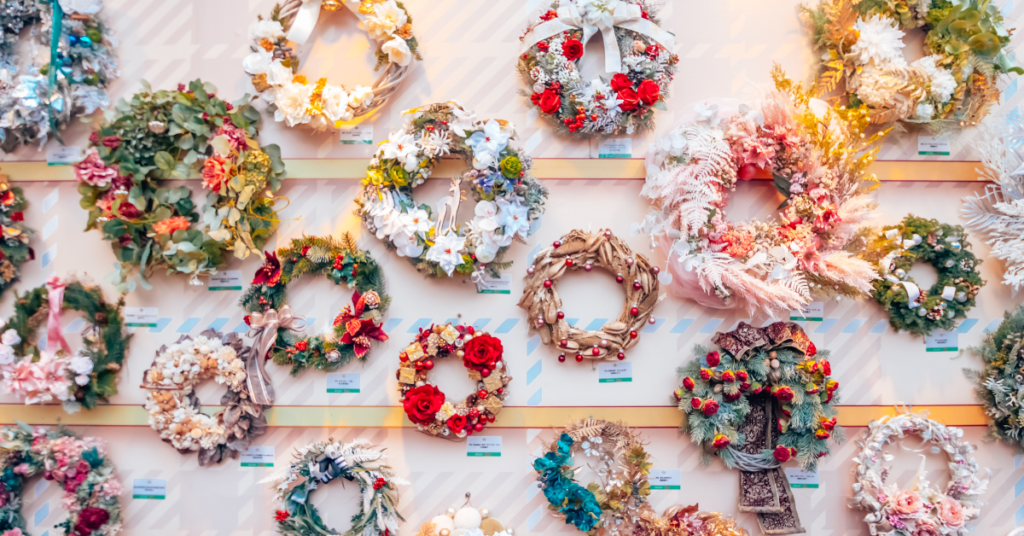 display of different christmas wreaths at a christmas market