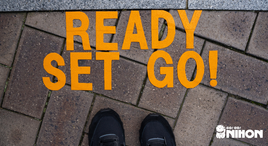 Image of text saying "ready set go!" on the ground outside.