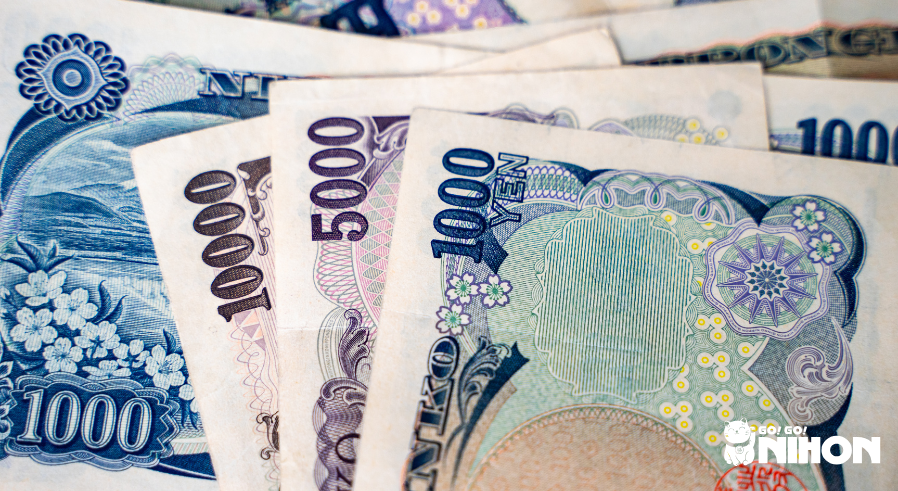 yen bills stacked on top of each other