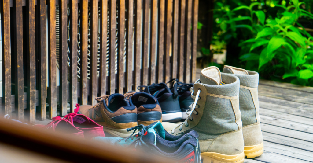 shoes lined up outside an entrance