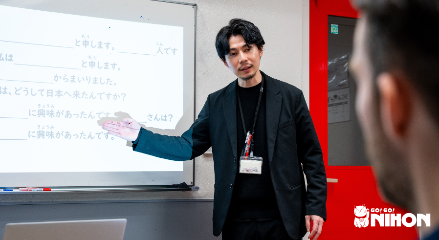 Male Japanese language teacher teaching at a Japanese language school