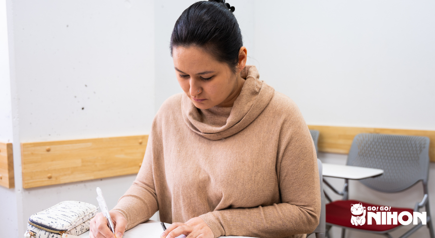 A student studying Japanese at a Japanese language school