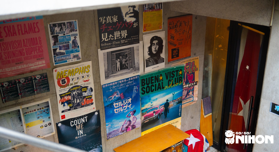 Cuban posters on a wall outside of a Cuban restaurant