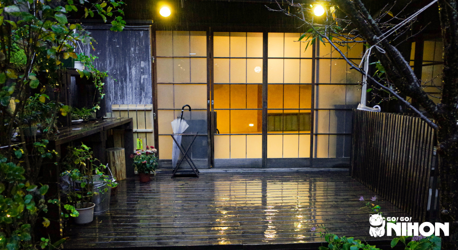 Exterior of a Japanese building in the rain during the summer