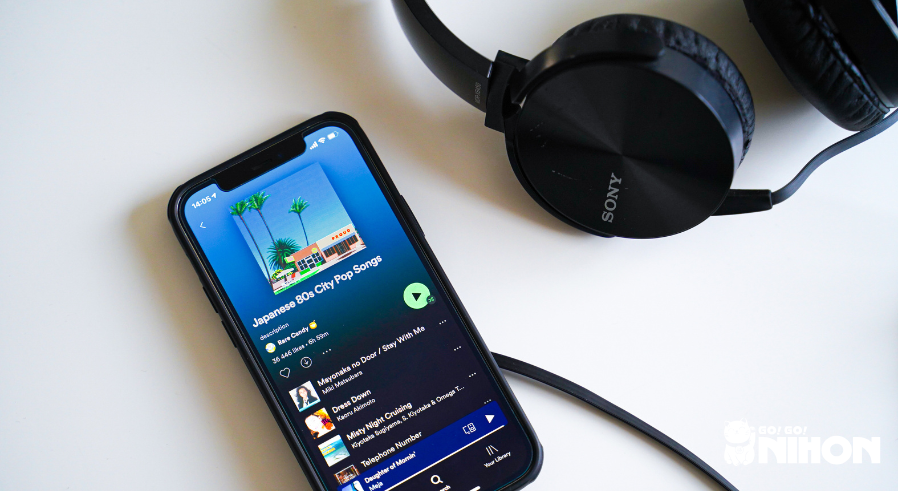 A smartphone with a Japanese 80s city pop playlist that can be listened to to practice Japanese outside of Japan