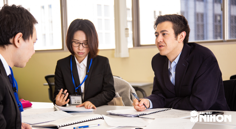 A group of Tokyo Galaxy students studying business Japanese