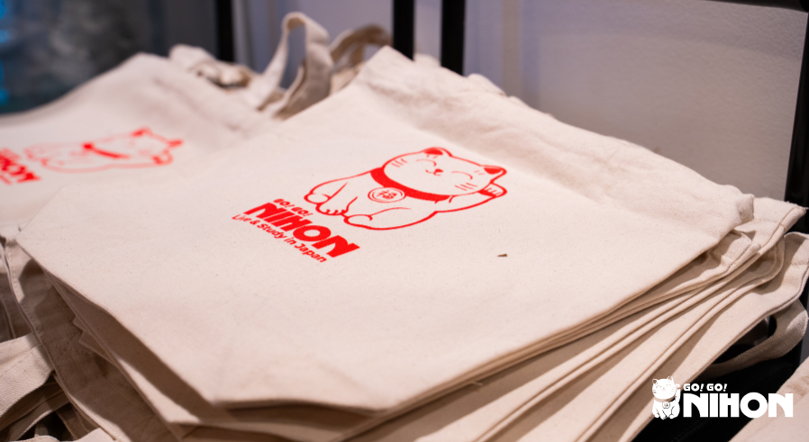 A stack of Go! Go! Nihon tote bags for students at our welcome event