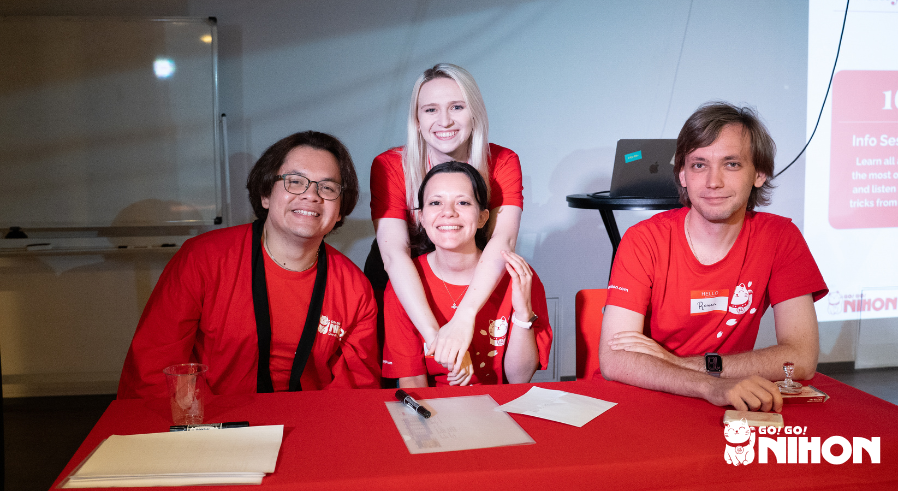 A group of Go! Go! Nihon staff members working at a welcome event