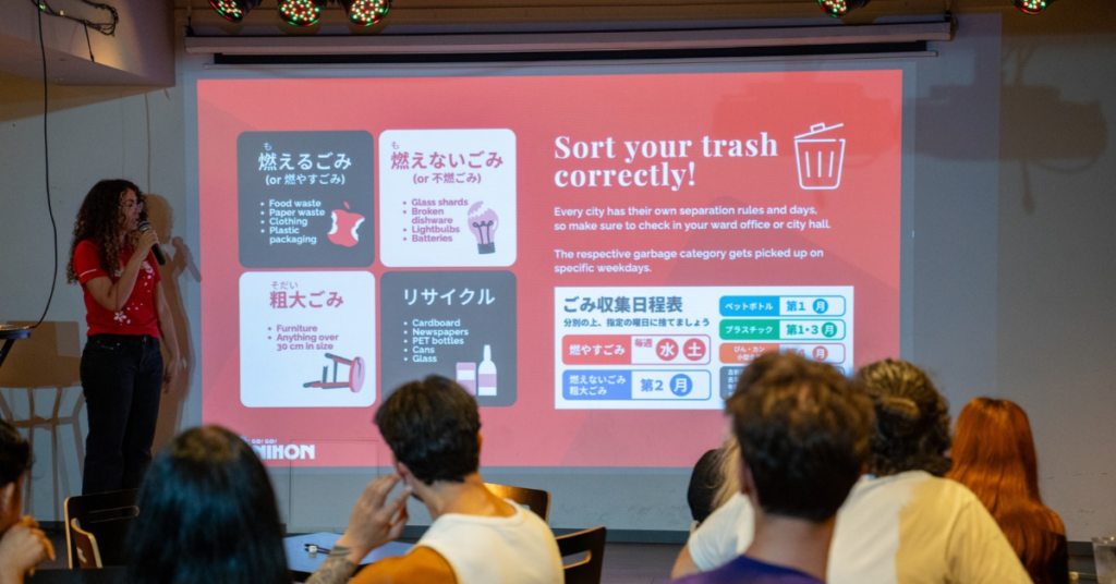 person presenting how to sort trash and recycling at a welcome event in japan